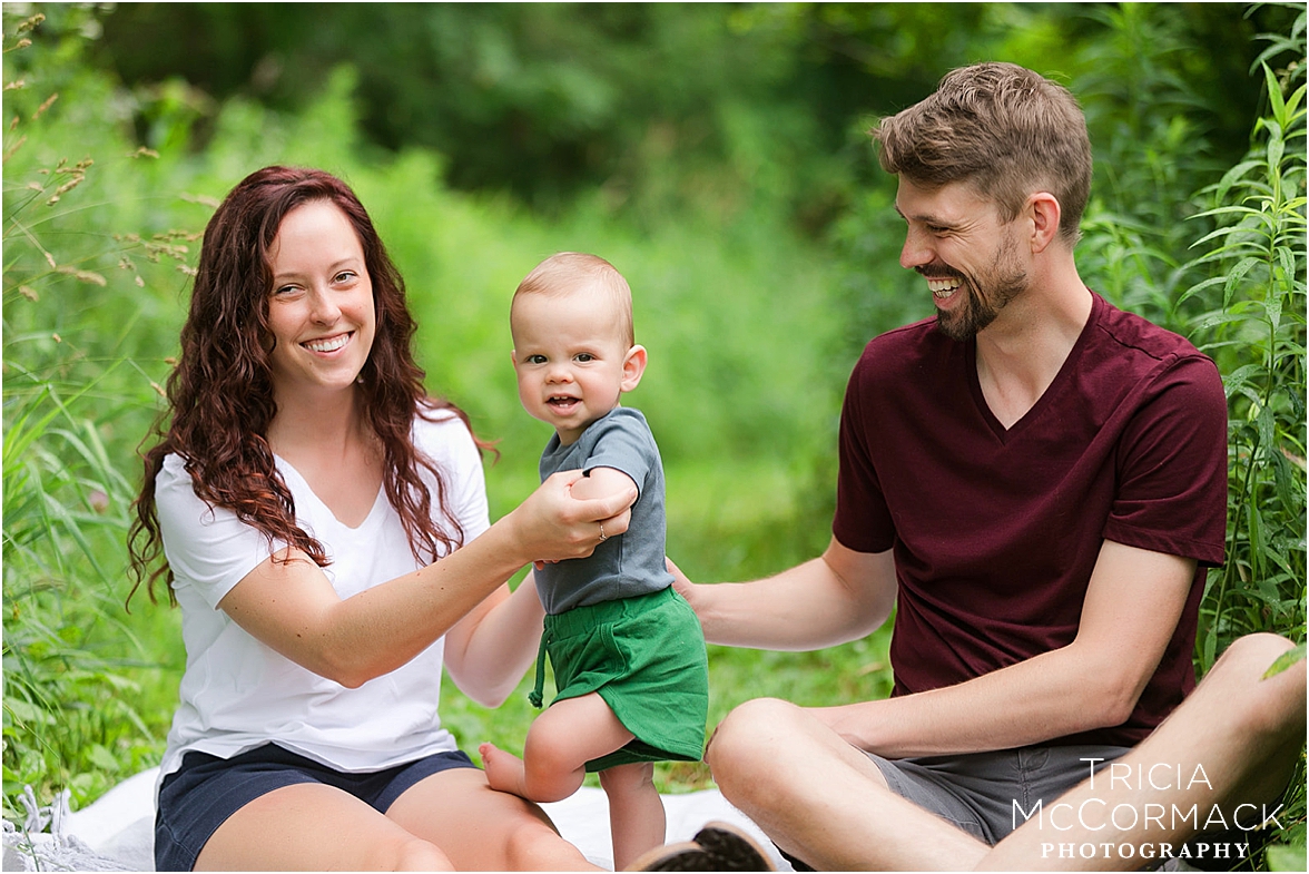 Candid family moment with toddler laughing and playing during a Berkshire lifestyle session by Tricia McCormack Photography.